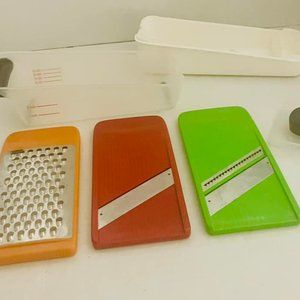 OXO COMPACT VEGETABLE SLICER WITH DIFFERENT COLOR BLADES with measuring cup lid